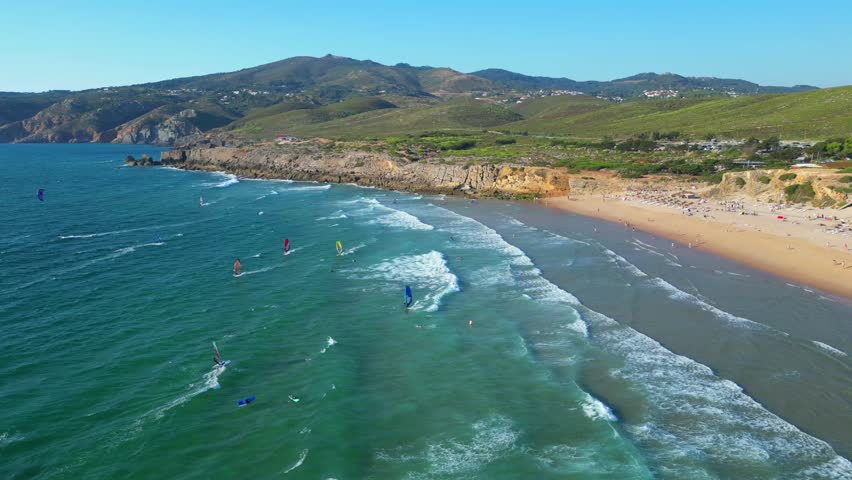 Aerial circular view from windsurfers at Guincho beach with the Serra de SIntra at background