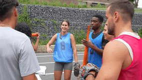 Professional baseball coach writing strategic notes while briefing diverse team members during intensive training session, focusing on tactical gameplay and skill development - Powered by Shutterstock - Get 15% off with code: PIKWIZARD15