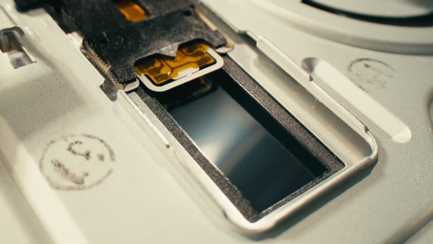 Floppy disc FDD close up, Using diskette for old PC computer macro. Archive programme or Music recorder, playing retro computer games. Vintage device for office, obsolete technology. 