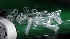 PET preforms. Making of Transparent PET plastic preforms move along automated conveyor belt in modern factory. Industrial production line concept for beverage bottles packaging automation recycling. - Powered by Shutterstock - Get 15% off with code: PIKWIZARD15