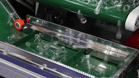 PET preforms. Making of Transparent PET plastic preforms move along automated conveyor belt in modern factory. Industrial production line concept for beverage bottles packaging automation recycling. - Powered by Shutterstock - Get 15% off with code: PIKWIZARD15