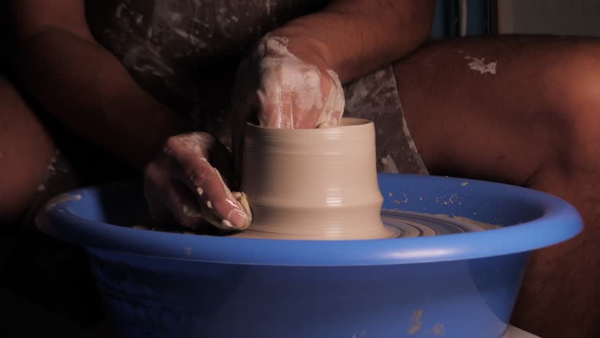 Working With Clay On A Pottery Wheel
