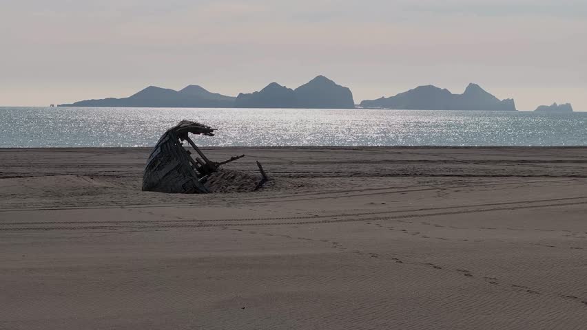 Serene View Of An Abandoned Wreck Wooden Boat At The Shores Of Vestmannaeyjar Archipelago In Iceland. Aerial Shot