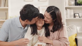 Young Asian family with daughter girls playing games at home Happy family-mother,father and daughter at home talking and smiling while spending time together - Powered by Shutterstock - Get 15% off with code: PIKWIZARD15