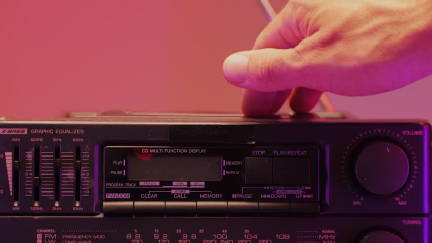 Retro radio tape recorder, audio cassette close-up. Listening to music, old radio boombox player, searching channel. 