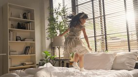 happiness cheerful Girl jumping on bed Adorable happy little girl in pajamas jumping on king-size bed in the morning. - Powered by Shutterstock - Get 15% off with code: PIKWIZARD15