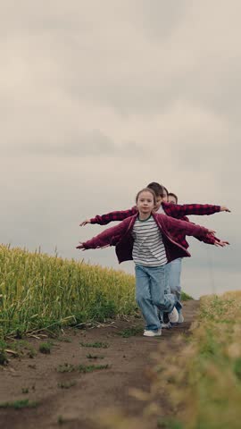 agriculture, children running for boys and girls, Group of kids having fun outdoors, teens running through field, playful moment in wheat, rural game for children, boys and girls on team, racing in