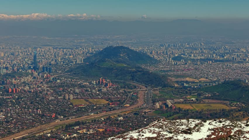 Aerial fly Santiago de Chile City with Small Plane Above Andes Snowy Mountain Peaks, Drone Panoramic View