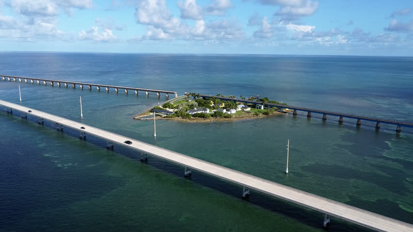 Drone shot flying away from Pigeon Key towards New Seven Mile bridge Florida Keys 2025 