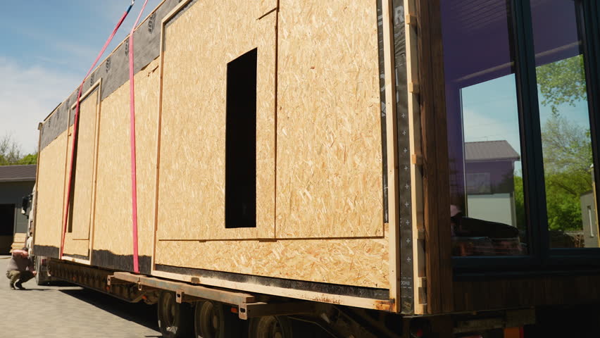 Prefabricated tiny house transporting on truck trailer