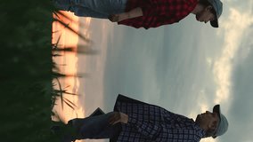 Modern man and woman farmers colleagues shaking hands greeting partnership dramatic sunset sky slowmo. Agricultural worker agronomist agrarian partner handshaking success deal collaboration at field - Powered by Shutterstock - Get 15% off with code: PIKWIZARD15