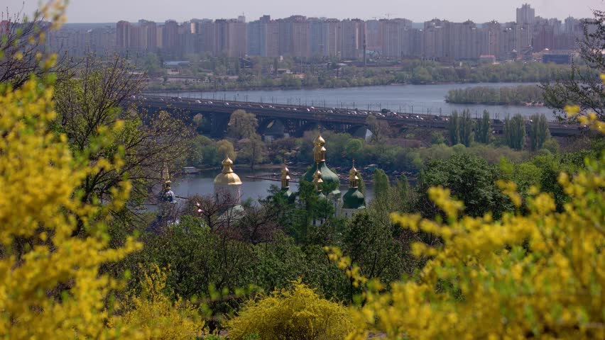Panoramic view from park of the city behind the river. View to Kyiv city from botanical garden.