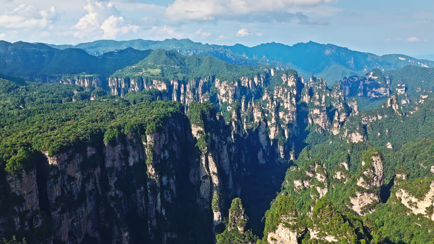 Majestic Zhangjiajie national forest park: towering sandstone pillars with lush green forest, Wulingyuan Scenic Area, Hunan Province, China.
