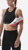 Vertical video: Gazing downward, female model adjusting shoe on shoulder and lifting gaze in studio. Athletic, fitness, sportswear, activewear, minimalist, lifestyle, vertical video - Powered by Shutterstock - Get 15% off with code: PIKWIZARD15