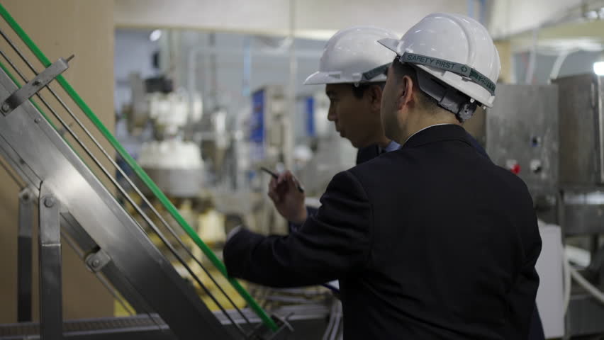 Employees are working at canned fish factory. Factory and occupation.