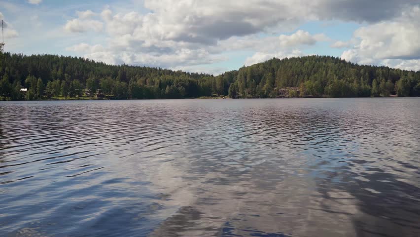 Finnish lake landscape from Kouvola, FInland in summer. Panning shot