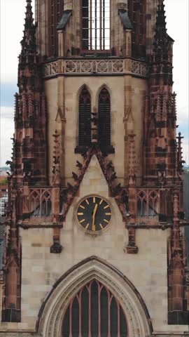 Drone vertical shot of St Agnes Cathedral gothic tower details in Cologne Germany