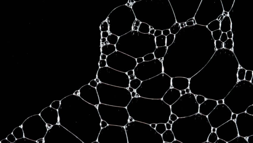 Texture of white soap foam with bubbles abstract background. Soap sud macro structure. Bathtup Soap Foam. Natural White Shampoo Bubbles Motion.