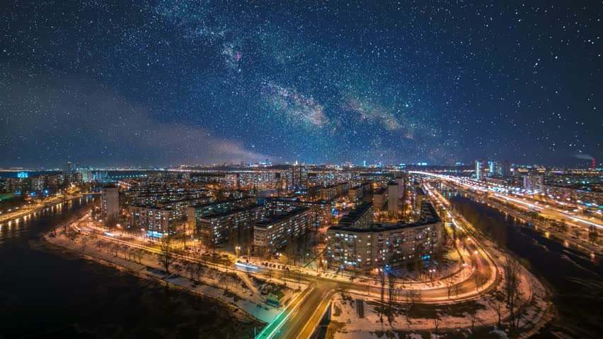 illuminated city streets at night, vibrant town life and architecture above with glowing lights and bustling activity. Car vehicle traffic road. Building even. star starry sky Milky Way Galaxy Space
