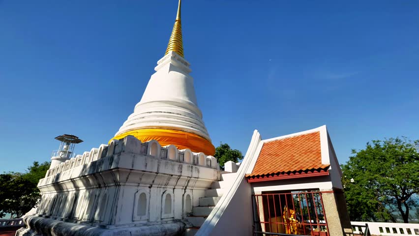 A scenic video of the white with golden top  pagoda  located on "Khao Tang Kuan" hilltop in "Songkhla" province, Thailand.  