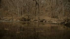 Off-roud crosses a mountain river in an autumn forest. Car Expedition. Action Video. Slow Motion 4K - Powered by Shutterstock - Get 15% off with code: PIKWIZARD15