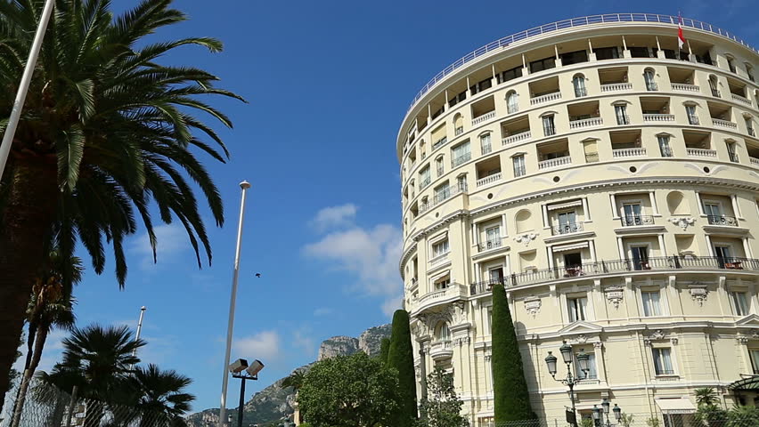 The curved frontage of the Hotel de Paris opposite the Casino in Monte Carlo, Monaco in bright sunlight