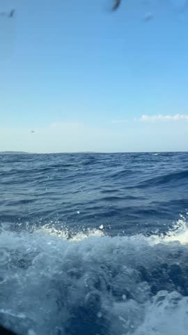 View through the bow cabin window of a sailing yacht leaning into the sea near Croatia. Sailing in strong wind, heeling movement and immersive life on board. High quality 4k footage