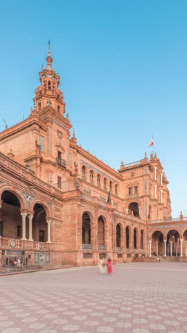 Plaza de Espana in Seville timelapse hyperlapse, a grand architectural complex in Maria Luisa Park built for the Ibero-American Exposition. Bridges and vintage streetlights during sunset