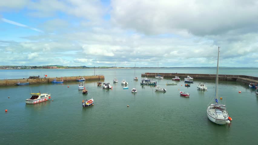 Reversing aerial video of Newcastle Harbour in County Down, Northern Ireland. Filmed in 4K, 60FPS and with Rec709 color.