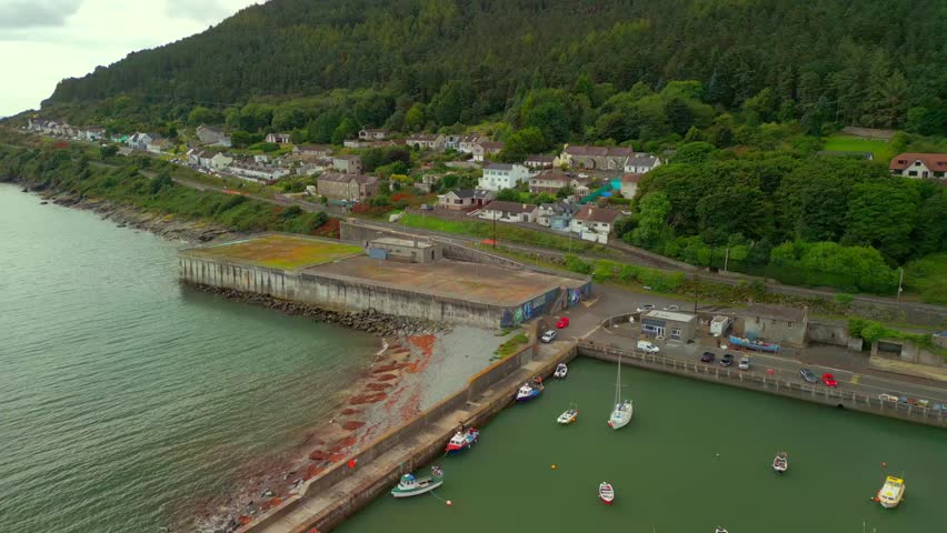 Reversing aerial video of Newcastle Harbour in County Down, Northern Ireland. Filmed in 4K, 60FPS and with Rec709 color.