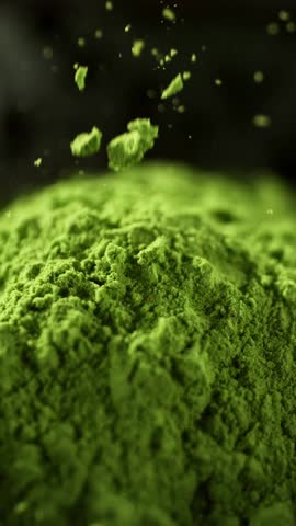 Super Slow Motion Detail Shot of Sprinkling Matcha Powder . Filmed on High Speed Cinematic Camera at 1000 FPS