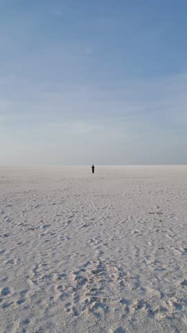 4K Aerial shot of salt flats at rann of Kutch during sunrise. White desert of Kutch in Gujarat, India. Aerial view over the expansive salt marsh of The Great Rann of Kutch. Tranquil Nature landscape.