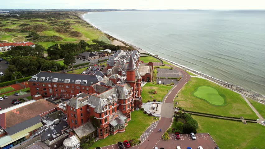 Rotating aerial video of Slieve Donard Hotel and Newcastle Beach in County Down, Northern Ireland. Filmed in 4K, 30FPS and with Rec709 color.