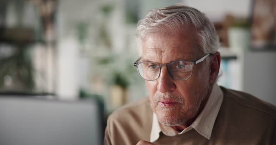 Business man, computer and reading at agency for proofreading, fast checking facts or verify info. Editor, mature person and tech in office for publication accuracy, credibility and article approval