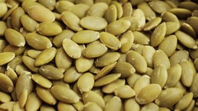 Pumpkin seeds close-up. Healthy vegetarian snack. High quality 4k footage - Powered by Shutterstock - Get 15% off with code: PIKWIZARD15