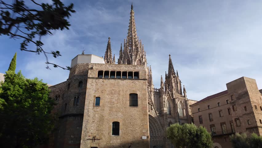 Hyperlapse revealing intricate Gothic architecture of Barcelona Cathedral standing majestically within historic Barri Gotic. Capturing ornate stone facade