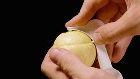 Close Up of Hands Using Special White Spoon to Cut and Open Yellow Passion Fruit Against Dark Background, Fresh Tropical Fruit Concept. - Powered by Shutterstock - Get 15% off with code: PIKWIZARD15