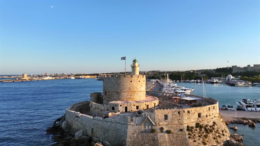 Rhodes Town in Greece, a vibrant mix of medieval old town and modern city life, with stone walls, narrow streets, beaches, and lively Mediterranean culture.
