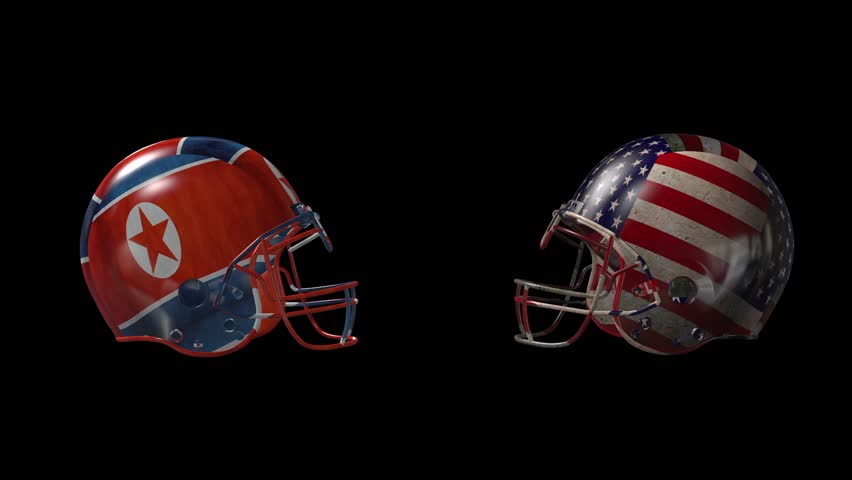two football helmets collide