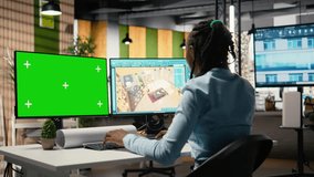 Female developer works on floor plan design with a chroma key screen, property development and construction planning. Zoning regulations and residential blueprints help with urban growth. Camera A. - Powered by Shutterstock - Get 15% off with code: PIKWIZARD15