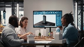 Real estate professionals engage in meeting to review blueprints and 3D models, planning for a large scale urban development project aimed at housing and infrastructure growth. Camera A. - Powered by Shutterstock - Get 15% off with code: PIKWIZARD15