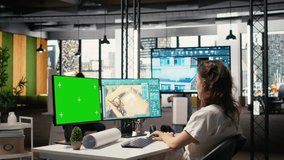 Real estate developer reviews project blueprints with chroma key in a corporate office, planning residential housing and property investment strategies for urban redevelopment. Camera A. - Powered by Shutterstock - Get 15% off with code: PIKWIZARD15