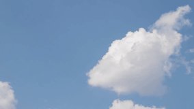 Timelapse of majestic cumulus clouds drifting across a vibrant blue sky. Clouds change shape as they move in the sky. Ever-changing cloudscape in air time lapse. Nature background. 4K footage. - Powered by Shutterstock - Get 15% off with code: PIKWIZARD15