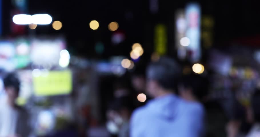 Defocused walking people at Ningxia night market in Taipei handheld