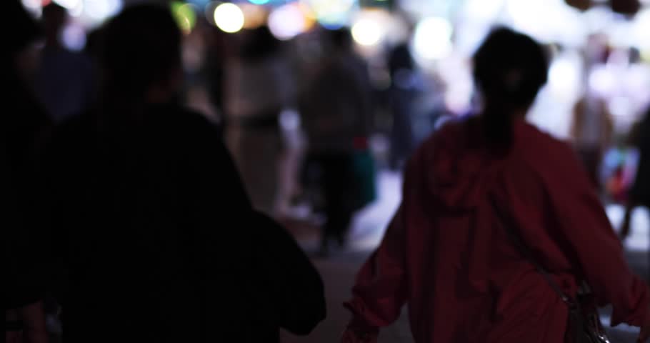Defocused walking people at Ningxia night market in Taipei handheld