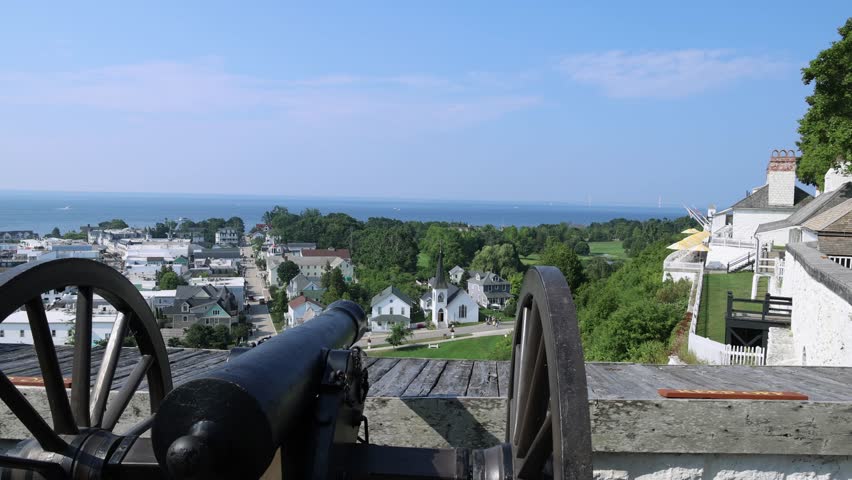 Antique canon overlooking Mackinac Island in Michigan with stable video shot.