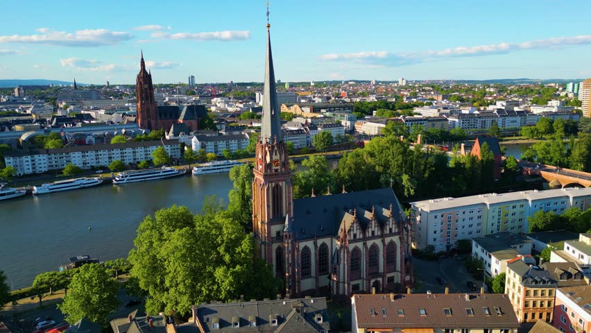 4K Drone Video of the neo-Gothic Evangelische Dreikönigskirche Church on the Main River in Downtown Frankfurt, Germany (Orbiting Shot)