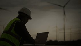 Engineer in safety vest using digital dashboard with global energy data and map interface. Concept of smart grid, renewable energy analytics, and clean technology. - Powered by Shutterstock - Get 15% off with code: PIKWIZARD15