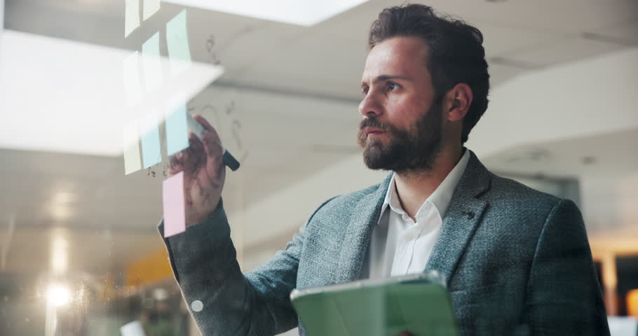 Businessman, strategy and writing on sticky note with tablet, online research and planning for project. Brainstorming, problem solving and person in office with digital tech, solution and ideas.
