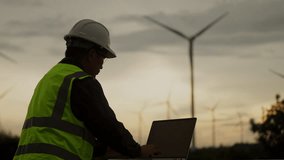 Engineer analyzing wind power performance on laptop in renewable energy field. Concept of smart data use, sustainable infrastructure, and future energy systems. - Powered by Shutterstock - Get 15% off with code: PIKWIZARD15